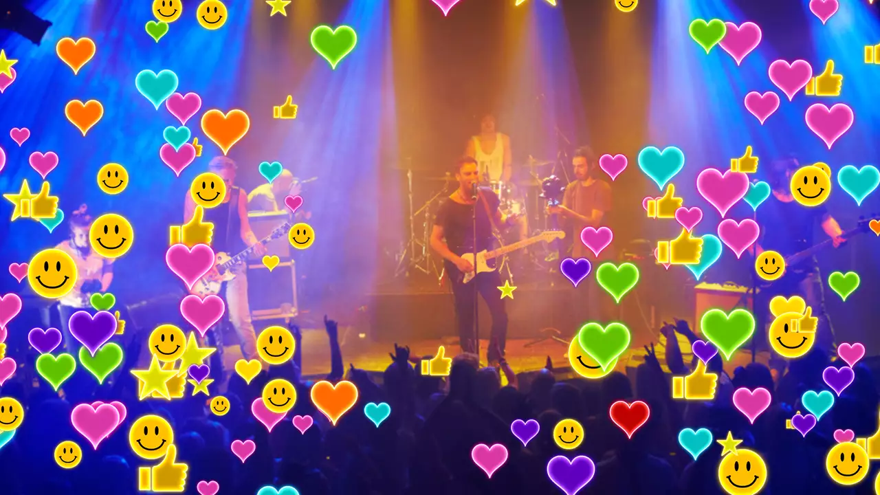 ステージでバンドがライブを行っている映像にVisibbyから送られたスタンプがバブルモードで表示されている。